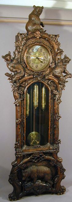 an ornate clock with animals on it