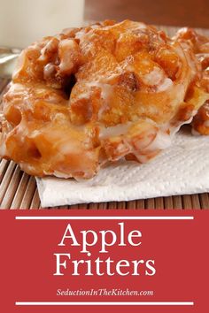 an apple fritters on a napkin with a glass of milk in the background