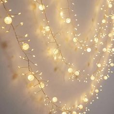 a string of lights hanging from the side of a wall