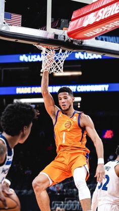 a basketball player dunking the ball during a game