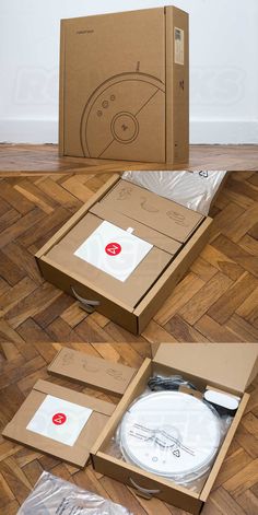 an open cardboard box on the floor with various items in it