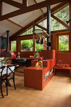 a kitchen with an oven, stove and dining room table in it's center