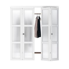 an open white closet with clothes hanging on it