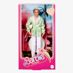 the barbie doll is wearing a green jacket and white pants