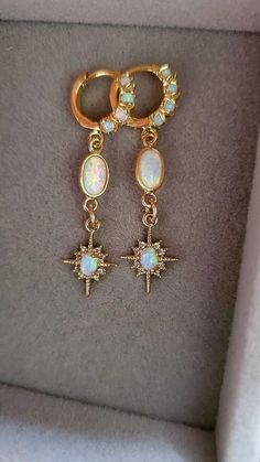 Starburst Opal Earrings  Gold huggie earrings with beautiful shine and a great celestial vibe.  Earrings: ~ 14k Gold Plated ~ With Opal Accents (the opals are synthetic man-made) 👉 Link to Our STOREFRONT: https://www.etsy.com/shop/FashionCrashJewelry?ref=shopsection_shophome_leftnav&ga_search_query=crystal%2Bnecklace Our Motto ~ Happy Customers Are Awesome 🌞Let us know of any problems or concerns with purchases. 🌞 5star reviews and positive comments are greatly appreciated, they help the succ Gold Huggies, Opal Drop Earrings, Positive Comments, Halloween Necklace, Christmas Gift Idea, Opal Earrings, Huggies Earrings, Earrings Gold, Birthstone