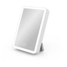 an electronic mirror is shown on a white surface