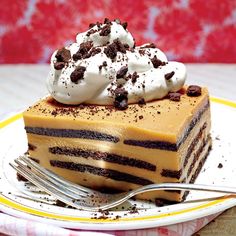 a piece of cake sitting on top of a plate next to a knife and fork