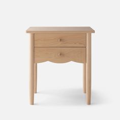 a small wooden table with two drawers on one side and an open drawer on the other