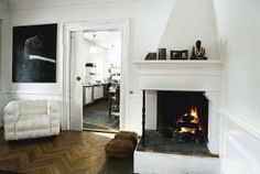 a living room filled with furniture and a fire place