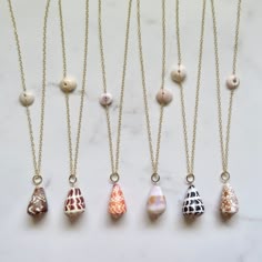 Long Cone Shell Necklaces~ Gorgeous big cone shells on 14k gold fill chain connecting with a puka shell. *Choose shell from the drop down menu. Each necklace varies in length ~ Shell #1 28" Shell #2 30" Shell #3 30" Shell #4 27" Shell #5 30" Shell #6 29" **Model wearing similar designs Shop~ http://www.etsy.com/shop/HanaMauiCreations?ref=pr_shop_more International buyers please read our shipping policies before ordering~ POLICIES~ https://www.etsy.com/shop/HanaMauiCreations/policy?ref=shopinfo_p Real Shell Jewelry, Limpet Shell Jewelry, Cone Shell Jewelry, Puka Shell Jewelry, Opihi Shell Jewelry, Small Shell Crafts, Surfer Girl Fashion, Shell Necklace Diy, Shell Rings