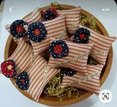 red, white and blue fabric flowers in a bowl