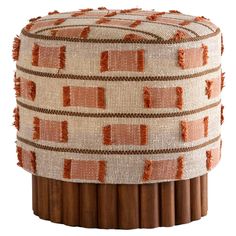 a small stool made out of wood sticks with orange and white designs on it's sides