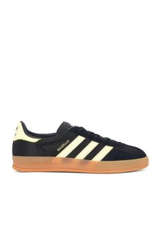 Find ADIDAS ORIGINALS BY ALEXANDER WANG Gazelle Indoor In Black on Editorialist. adidas Originals Gazelle Indoor in Black Suede, leather, and mesh upper with rubber gum sole. Made in Vietnam. Lace-up front. Signature three stripes at side panels. Gold-tone printed Gazelle logo at outer panel. Padded low-cut leather collar with contrast back counter and Adidas logo. ADIO-MZ157. IG4999. About the designer: April Inspiration, Adidas Originals Gazelle, Summer Uniform, Leather Collar, Clean Girl, Side Panels, Adidas Logo, Mens Shoes Sneakers, Panel Siding