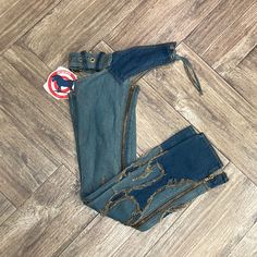 - Women’s Blue Flame Chaps By Very Bad Horse - Size Xs And S Available - 100% Cotton Denim - Functional Zippers On Bottom - Functional, Adjustable Buckles And Ties - Brand New With Tags Attached