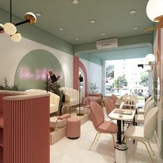 the interior of a restaurant with pink and white furniture