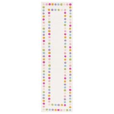 a white bookmark with multicolored dots on it