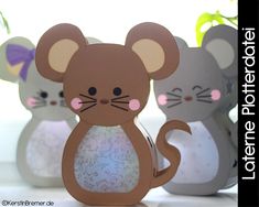 three paper mouses sitting next to each other