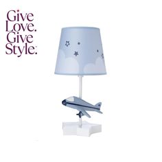 a lamp with a plane on it and the words give love, give style above it