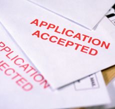 several envelopes that have been placed on top of each other with the words application accepted