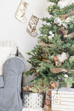 a christmas tree with presents under it