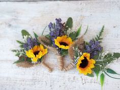 three sunflowers tied to burlock with lavender and greenery on top