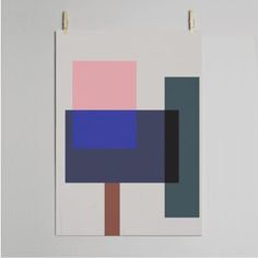 an abstract painting hanging on a wall