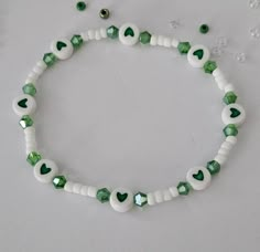 St. Patrick's Day beaded bracelet with Charms and Letter Beads, St. Patrick's Day, Stretch Bracelet This bracelet is made with custom sizing.  You choose from 6 to 8 inches. if you need a smaller or larger size please message me the details. Listing includes ONE bracelet. Any images shown with multiple bracelets is to be used as an example of how they can be stacked with other Bracelets. ALL ORDERS ARE FINAL SALE. THESE ARE CUSTOM BRACELETS MADE TO ORDER. PLEASE DOUBLE CHECK SIZE SELECTIONS PRIOR TO CHECKOUT.  CARING TIPS:  - Do not expose jewelry to water - Treat and store jewelry gently - Roll bracelets on rather than stretching band to get on. The beads used for this bracelet are small (8/0 Glass Seed Beads) and should not be used for children under 4 years old.  Please don't let the ch Beaded Bracelet With Letters, Concert Bead Bracelets, Double Beaded Bracelet Diy, Basic Beaded Bracelet, Cute Small Bead Bracelet Ideas, Bracelet Small Beads, Fun Beaded Bracelets, Small Beads Ideas, St Patricks Day Bracelet