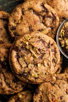 chocolate chip cookies are piled on top of each other