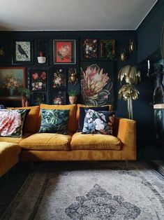 a living room filled with lots of furniture and pictures on the wall next to it