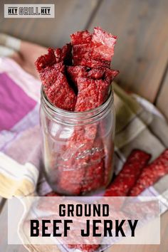 ground beef jelk in a glass jar on a wooden table with the words ground beef jelk above it