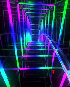 an image of a tunnel with neon lights