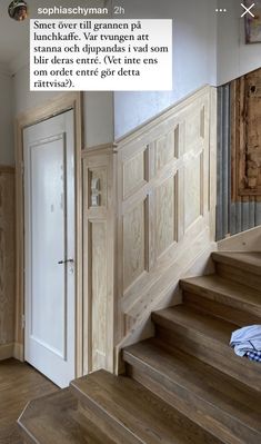 an open door and some wooden stairs in a room with wood flooring on the walls