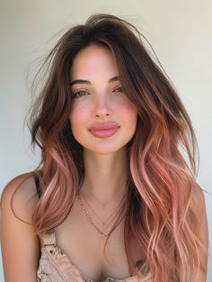 For a trendy and low-maintenance option, consider the rose gold root fade. This style features dark roots that naturally fade into a luminous rose gold hue, creating a seamless transition. It’s ideal for those who want to extend the time between color treatments and works beautifully on medium to dark hair bases. Brunette And Rose Gold Balayage, Colored Hair With Dark Roots, Rose Gold Hair Copper, Fun But Professional Hair Color, Rosewood Hair Color, Grown Out Roots, Unique Hair Color Ideas For Blondes Rose Gold, Fall Hair Rose Gold, Balayage Hair Pink