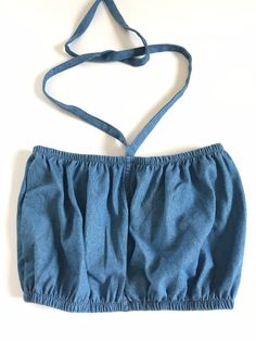 "These are handmade and reworked from old denim made into the perfect bubble tube tops that can be worn as halters or have the straps tucked in and worn as tubes. They best fit a small/ medium and fit from 24\"-30\" and are shown on a size medium model. The perfect summer wardrobe essential to pair with vintage Levis and prairie skirts. This listing is for one reworked bubble tube ✨(15)" Summer Stretch Denim Blue Denim Vest, Summer Stretch Denim Blue Vest, Fitted Denim Halter Neck Top, Summer Stretch Denim Vest In Medium Wash, Stretch Medium Wash Denim Vest For Summer, Summer Denim Stretch Tube Top, Stretch Denim Tube Top For Summer, Summer Stretch Denim Tube Top, Casual Denim Halter Neck Top