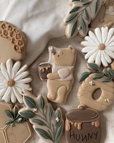 some cookies are decorated with flowers and bears