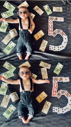 a baby is laying on the ground surrounded by money