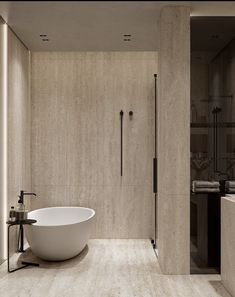 a large white bath tub sitting inside of a bathroom next to a walk in shower