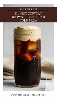 a glass jar filled with brown sugar and ice cream sitting on top of a table