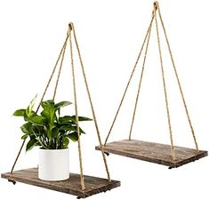 two hanging planters with plants in them on wooden boards, one holding a potted plant