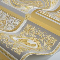 an ornate gold and silver wallpaper design