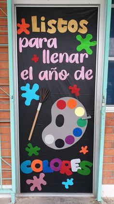 a door decorated with an image of a painting palette and paintbrush