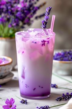 a purple drink with lavender flowers in the background