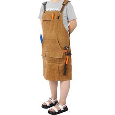 The Fully Adjustable Long Heavy Duty Woodworking/Carpenters 18 Oz Waxed Canvas Tool Apron is crafted from 100% waxed cotton canvas, providing both durability and comfort with its heavy-duty 18 oz fabric and double stitching. This brown canvas apron offers full coverage (27 inches wide x 33 inches long), ensuring protection down to the knees. It features ample storage with various tool pockets, including chest pockets for pens and phones, and a hammer loop, making it perfect for woodworkers, mach Tool Apron, Kitchen Aprons, Brown Canvas, Waxed Canvas, Waxed Cotton, Heavy Duty, Cotton Canvas, Apron, Tools