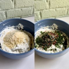 two blue bowls filled with different types of food on top of a white table next to a brick wall