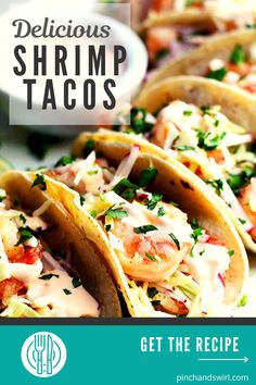 three shrimp tacos on a plate with text overlay that reads delicious shrimp tacos get the recipe