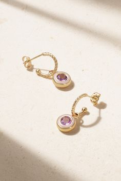 Alison Lou's 'Madison' earrings are interchangeable, so you can wear them as a simple hoop or with the jeweled charm, depending on your mood. They're cast from 14-karat gold and set with a sparkling laboratory-grown amethyst framed by matching purple enamel. Elegant Gold Amethyst Hoop Earrings, Fine Jewelry Bezel Set Hoop Earrings As Gift, Elegant Purple Round Hoop Earrings, Alison Lou, Feminine Jewelry, Family Jewels, Purple Jewelry, Purple Earrings, Gold Pearl Earrings