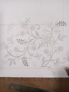 a piece of paper with flowers and leaves drawn on it