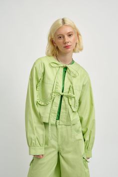 The Carrie jacket is back in pistachio green twill! This season's version still has it's frilly patch pockets and delicate front ties but we've added bold tonal top stitching in apple green. - 100% Cotton twill - Pistachio twill with green topstiching- Slips on and ties at the front- Machine wash gentle, cool water, hang to dry- Made in Canada Flat measurements in inches are as follows: Size - Bust - Waist - LengthXS: 38, 38, 19S: 40, 40, 19M: 42, 42, 19L: 44, 44, 19XL: 46, 46, 20XXL: 48, 48, 20 Sweater Jumpsuit, Twill Jacket, 2024 Christmas, Pistachio Green, Under Dress, Apple Green, Summer Accessories, Christmas Wishlist, Green Jacket