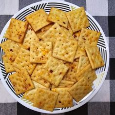 some crackers are on a white and black plate