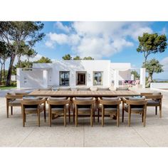 a large wooden table with chairs around it